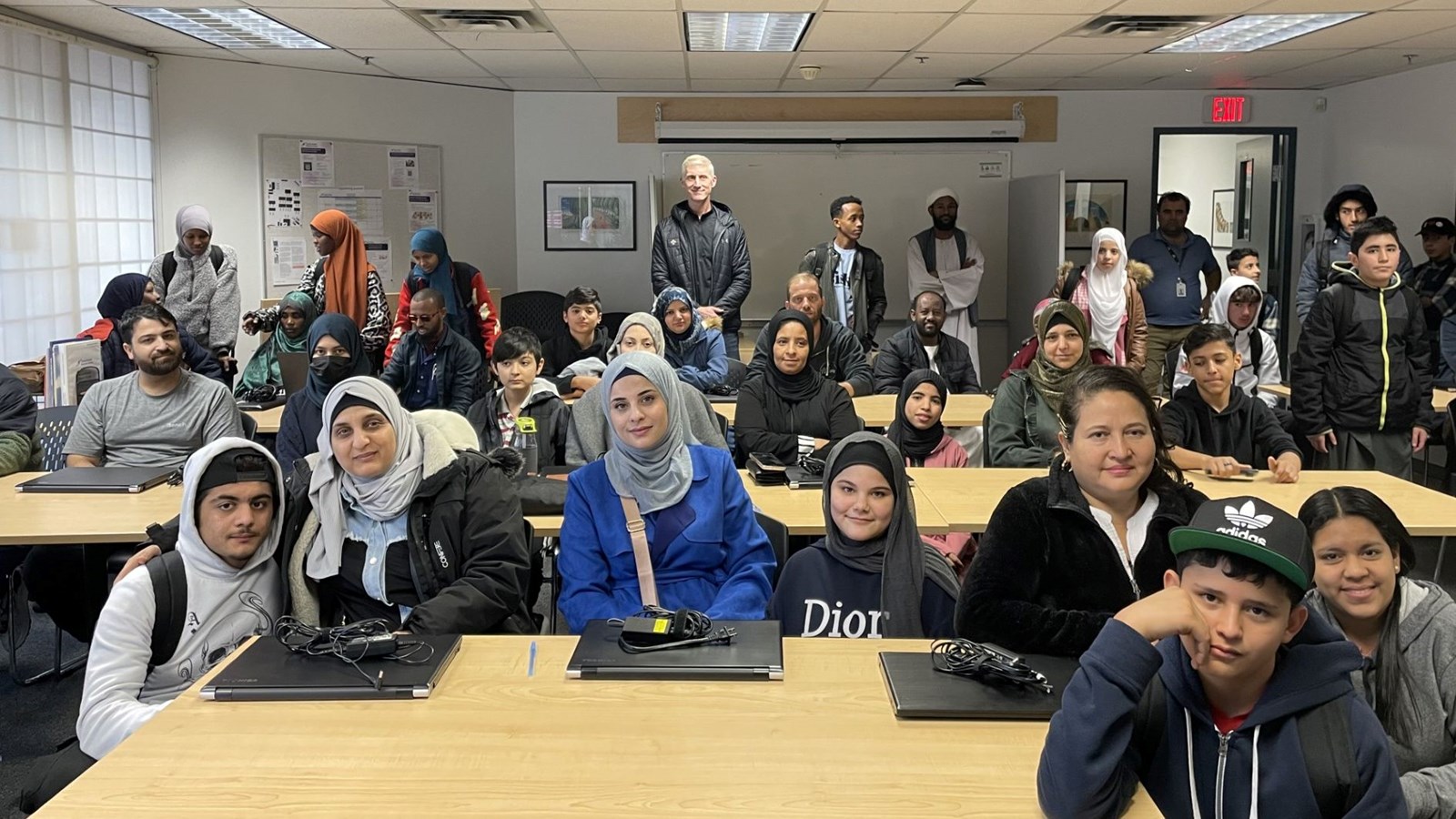 Surrey Fire Fighters’ Charitable Society donates 190 laptops for newcomer students